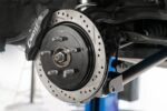 15" Conversion Kit by Carlyle Racing, Drilled and Slotted Rotors, Black Calipers BMR Suspension for Cadillac CTS-V 2008-2014