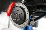 15" Conversion Kit by Carlyle Racing, Drilled and Slotted Rotors, Red Calipers BMR Suspension for Cadillac CTS-V 2008-2014